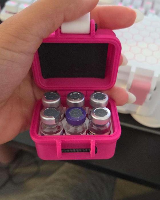 Hot pink mini case holding six vials