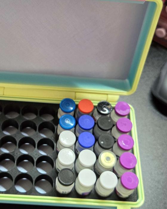 Pastel vial organizer with colorful caps